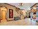 Bright entryway with hardwood floors and unique art pieces at 2107 Westover Reserve Blvd, Windermere, FL 34786