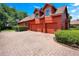 Three-car garage with brick pavers and basketball court at 2107 Westover Reserve Blvd, Windermere, FL 34786