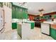 Spacious kitchen with green cabinets, marble countertops, and hexagon tile floors at 2107 Westover Reserve Blvd, Windermere, FL 34786