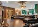 Relaxing living room with leather sectional sofa and hardwood floors at 2107 Westover Reserve Blvd, Windermere, FL 34786