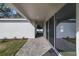 Outdoor walkway featuring brick pavers, leading to sliding glass doors with view of backyard at 2138 Forest Cir # 32, Orlando, FL 32803