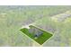 Stunning aerial view of a modern home surrounded by lush greenery in a serene neighborhood at 95 Malauka Place Trak, Ocklawaha, FL 32179