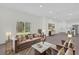 Living room features couch, marble table, and views of the lush backyard at 95 Malauka Place Trak, Ocklawaha, FL 32179