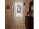 Long hallway with access to two bathrooms and closets at 517 Cardinal Dr, Kissimmee, FL 34759