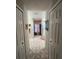 Bathroom hallway with access to a walk-in shower and closets at 517 Cardinal Dr, Kissimmee, FL 34759