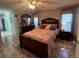 Spacious bedroom with a queen bed and en-suite bathroom at 517 Cardinal Dr, Kissimmee, FL 34759