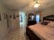 Bright bedroom with a queen bed and access to the bathroom at 517 Cardinal Dr, Kissimmee, FL 34759