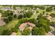 Aerial view of condo complex with lush trees and golf course at 7250 Westpointe Blvd # 1035, Orlando, FL 32835