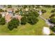 Aerial view of a lush green community with mature trees and a playground at 7250 Westpointe Blvd # 1035, Orlando, FL 32835