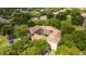 Aerial view of the condo complex surrounded by mature trees at 7250 Westpointe Blvd # 1035, Orlando, FL 32835
