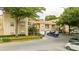 Exterior of condos featuring blue railings and lots of green trees at 7250 Westpointe Blvd # 1035, Orlando, FL 32835