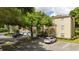 Exterior view of condos with parking featuring lush landscaping at 7250 Westpointe Blvd # 1035, Orlando, FL 32835
