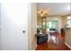 Living room with hardwood floors, ceiling fan, and sliding glass doors at 7250 Westpointe Blvd # 1035, Orlando, FL 32835