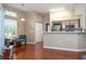Bright living room with hardwood flooring and a view into the kitchen area at 7250 Westpointe Blvd # 1035, Orlando, FL 32835