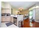 Open concept kitchen featuring updated appliances and breakfast bar perfect for modern living and entertaining guests at 7250 Westpointe Blvd # 1035, Orlando, FL 32835