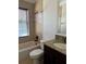 Bathroom features a tiled shower, granite vanity, and modern fixtures at 2211 Rickover Pl, Winter Garden, FL 34787