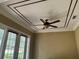 Decorative ceiling fan highlights this room with a trey ceiling and ample light at 2211 Rickover Pl, Winter Garden, FL 34787