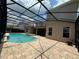 Inviting screened-in pool and spa with ample deck space for entertaining and relaxation at 2211 Rickover Pl, Winter Garden, FL 34787