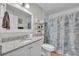 Bathroom with granite countertop and seashell decor at 5018 Se 106Th Pl, Belleview, FL 34420