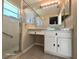 Bathroom features a glass shower and updated vanity at 3844 Eversholt St, Clermont, FL 34711