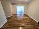 Bright bedroom with hardwood floors and sliding door access at 3844 Eversholt St, Clermont, FL 34711