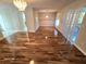 Dining room with hardwood floors and access to kitchen at 3844 Eversholt St, Clermont, FL 34711