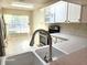 View of kitchen sink and stainless steel appliances at 3844 Eversholt St, Clermont, FL 34711