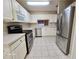 Kitchen with stainless steel appliances and white cabinets at 3844 Eversholt St, Clermont, FL 34711