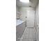 Laundry room with washer, dryer, and built-in shelving at 3844 Eversholt St, Clermont, FL 34711