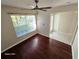 Living room features hardwood floors and large window at 3844 Eversholt St, Clermont, FL 34711