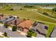 Aerial view of homes and neighborhood with conservation area at 737 Alcove Dr, Groveland, FL 34736