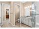 Main bathroom with granite countertops and walk-in shower at 737 Alcove Dr, Groveland, FL 34736