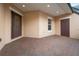 Covered brick entryway with decorative glass door and additional side entrance at 737 Alcove Dr, Groveland, FL 34736