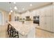 Well-equipped kitchen boasting a large island, custom cabinetry, and built-in appliances at 737 Alcove Dr, Groveland, FL 34736