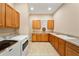 Spacious laundry room featuring modern washer and dryer units and ample cabinet space at 737 Alcove Dr, Groveland, FL 34736