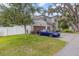 Two-story house with a double garage and a blue car parked in the driveway at 222 Emmy Cv, Oviedo, FL 32765