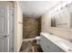 Bright bathroom with a double sink vanity and modern tile shower at 122 Club Rd, Sanford, FL 32771