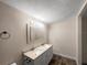 Well-lit bathroom featuring a double sink vanity with great lighting and large mirror at 122 Club Rd, Sanford, FL 32771