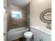 Stylish bathroom with tiled shower/tub, modern vanity, and updated fixtures at 122 Club Rd, Sanford, FL 32771
