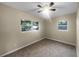 Comfortable bedroom with neutral carpet and dual windows offering natural light at 122 Club Rd, Sanford, FL 32771