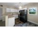Updated kitchen featuring granite countertops, stainless steel appliances, and ample cabinet space at 122 Club Rd, Sanford, FL 32771