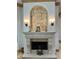 Elegant fireplace with ornate mantel and decorative wall detail at 3036 Seigneury Dr, Windermere, FL 34786