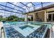 Resort-style pool with spa, outdoor kitchen, and covered patio at 3036 Seigneury Dr, Windermere, FL 34786