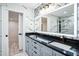 Stylish bathroom featuring a double vanity with modern fixtures and luxurious tile accents at 1860 Via Contessa, Winter Park, FL 32789