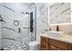 Elegant bathroom with marble walls, a modern shower with black hardware, and a stylish vanity at 1860 Via Contessa, Winter Park, FL 32789