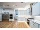 Contemporary kitchen with stainless steel appliances, double ovens, and sleek white cabinetry at 1860 Via Contessa, Winter Park, FL 32789