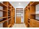 Beautiful, large, organized walk-in closet with custom shelving, drawers, and ample storage space at 1860 Via Contessa, Winter Park, FL 32789