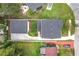An aerial view displays the home's backyard, driveway, and landscaping surrounding the property at 3480 Fairway Ln, Orlando, FL 32804