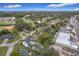The aerial shot displays the property's location near community amenities, green spaces, and a commercial area at 3480 Fairway Ln, Orlando, FL 32804