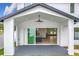 Covered back patio with an open concept view into the kitchen and the living space at 3480 Fairway Ln, Orlando, FL 32804